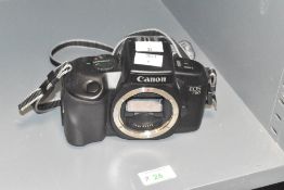 A Canon EOS 750 35mm film camera.
