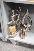 An Art deco style brass table lighter raised on a diamond shaped base , h18.5cm, sold together