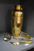 A brass vase decorated with sea shell patterns, h30cm, sold together with a magnifying loupe,