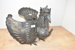 A Indonesian cast brass oil lamp used for puppet performances, h33cm