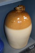 A large stoneware flagon having impressed marks for 'G Braithwaite Jn Wine & Spirit Merchant
