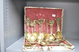 A quantity of novelty brass caddy/soup spoons, to include Saint George and the Dragon and Robbie