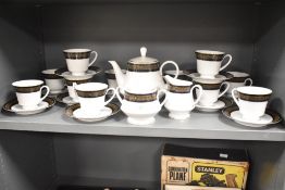 A Noritake tea service comprising of tea pot, 11 cups, 11 saucers, sugar bowl and cream jug