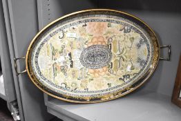 A vintage serving tray of oval form with handles, w60cm