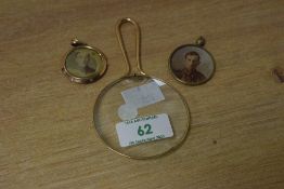Two early 20th century sweetheart pendants, sold together with a magnifying glass