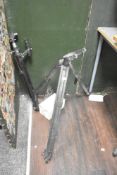 A tri-pod camera stand, sold alongside 1 other