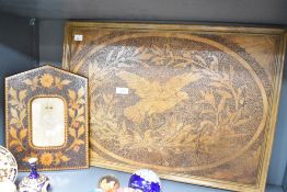 A wooden picture frame, h30cm, sold with a similar wall plaque