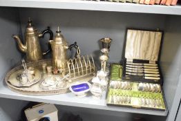 A quantity of silver plated cutlery, to include spoons, toast rack, tray, salt and pepper ect