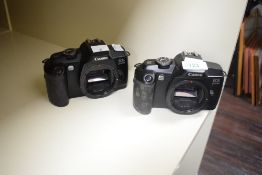 Two Canon EOS 5000 35mm film cameras.