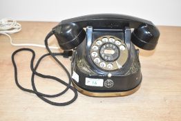 A vintage rotary bell telephone, h13cm