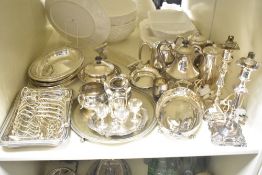 A pair of silver plated candle sticks, sold together with toast rack, tea pot and cream jug ect