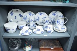 A Coalport part dinner service decorated with blue floral patterns on a white ground, to include