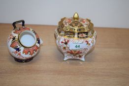 A Royal Crown Derby 'Old Imari' pattern sugar bowl having shaped body and compressed style cover,