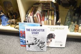 A box containing various books, to include The Animals War and The Great Battles of World War II