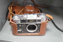 Two camera bodies. A Fed 4 and a Contax 167MT