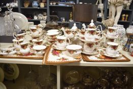 A Royal Albert Old Country Rose dinner service having gilt edges and floral patterns, to include tea