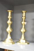 A pair of polished brass candlesticks, h30cm