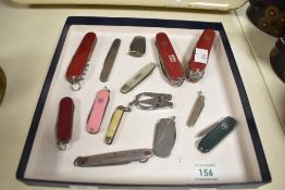 A Victorinox stainless steel pocket knife, L6cm, sold together with 13 others