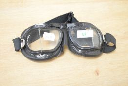 A pair of Halcyon motorcycle racing goggles