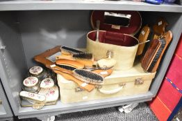 A vintage ladies vanity/grooming set, (6), sold together with a travel trunk, vintage shoe brushes