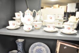 A New Chelsea fine bone china tea service having gilt edges and floral patterns, painted no to