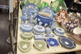 A quantity of Wedgwood Jasper ware, to include a pair of candlesticks, plates and trinket boxes,