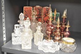 A quantity of glass perfume bottles and trinket dishes