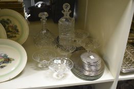 Two cut glass decanters sold together with six cut glass candy dishes and a selection of silver-