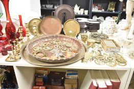 A large brass charger decorated with floral designs, w46cm, sold together with a Moroccan plant