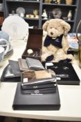 A Mercedes-Benz teddy bear mascot, h26cm, sold together with key, pen, keyring and a Colibri Monopol