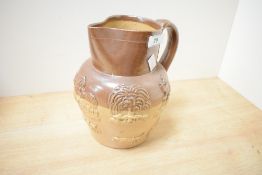 A Doulton Lambeth style salt-glazed stoneware jug decorated with hunting and harvest scenes, h21cm
