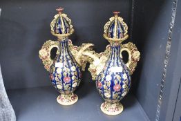 A pair of Majolica style ceramic beakers with covers, H39cm