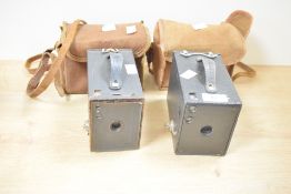 Two Kodak Brownie box cameras. One No. 2 Brownie Model D, one No. 2 Brownie Model F, with hinged