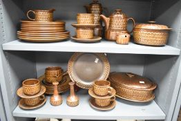 A vintage Wedgwood Pennine dinner service having geometrical patterns on a brown ground, to