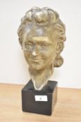 A ceramic female bust raised on a square plinth, signed 'B. Buoualuia', h31cm