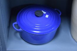 A Le Creuset cast iron casserole pan with cover, w31cm