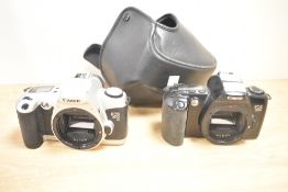 Two Canon 35mm cameras, a Canon EOS 500 and Canon EOS 500N. The Canon EOS 500 was the world’s