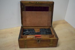 An antique writing-slope containing 32 miniature volumes of Shakespeare, published by Allied