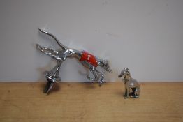 A Racing Greyhound car mascot sold with a seated Greyhound