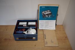 A boxed Wilkson Auto Electric test kit