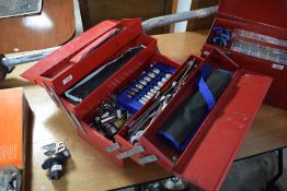 A cantilever tool box containing sockets and spanners