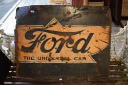 An enamel 'Ford the Universal Car' sign worn and with rust