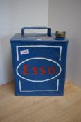 An Esso fuel can with brass cap