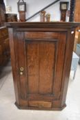A 19th Century oak corner cupboard, height approx. 107cm