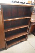 An early 20th Century mahogany bookshelf having waterfall style bottom shelf, width approx. 69cm