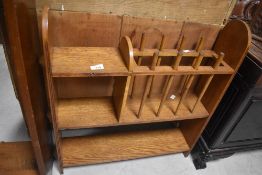 An Arts & Crafts oak bookshelf , having magazine section