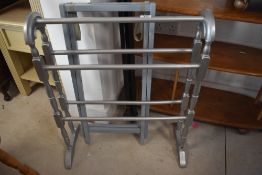 A traditional towel rail, over painted in silver