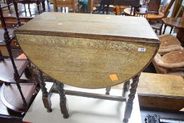A mid 20th century barley-twist oak drop-leaf gale-leg table 75cm x 75cm x 40cm closed.