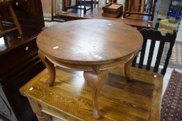 A 20th century mahogany circular occasional table with four cabriole type supports 40cm x 63cm