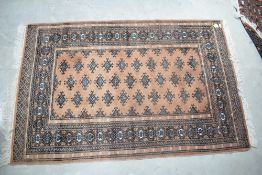 A North West Persian Bokhara type rug, with tasselled ends 149cm x 99cm